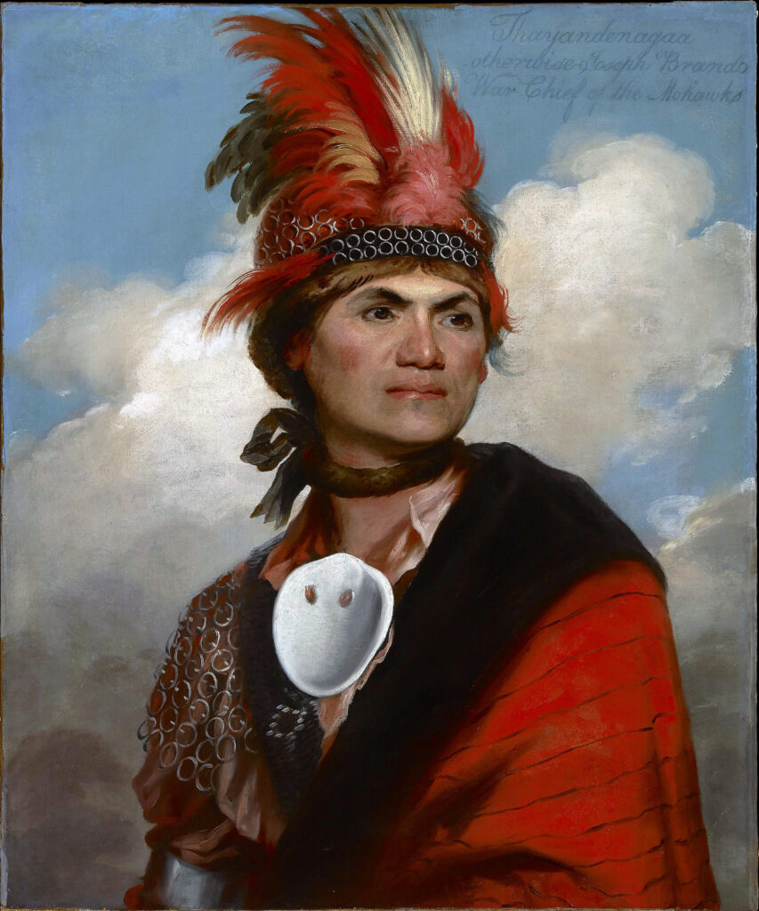 Painted Portrait of Joseph Brant. He wears a read and white feathered hat.